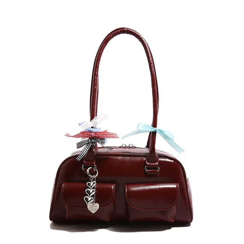 Retro brown PU women's pillow handbag with a flap closure and double shoulder strap.