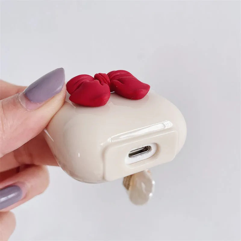 Beige red bow shell TPU AirPods case cover with clamshell design for AirPods 3, Pro 3, and 1/2 models