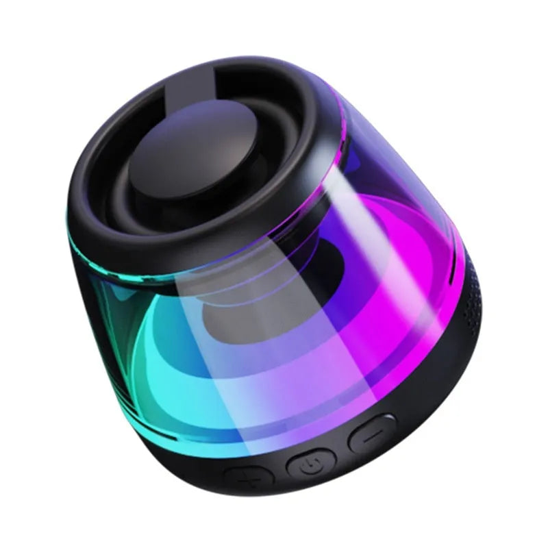 Compact black or white portable Bluetooth speaker with magnetic base and built-in ambience lighting.