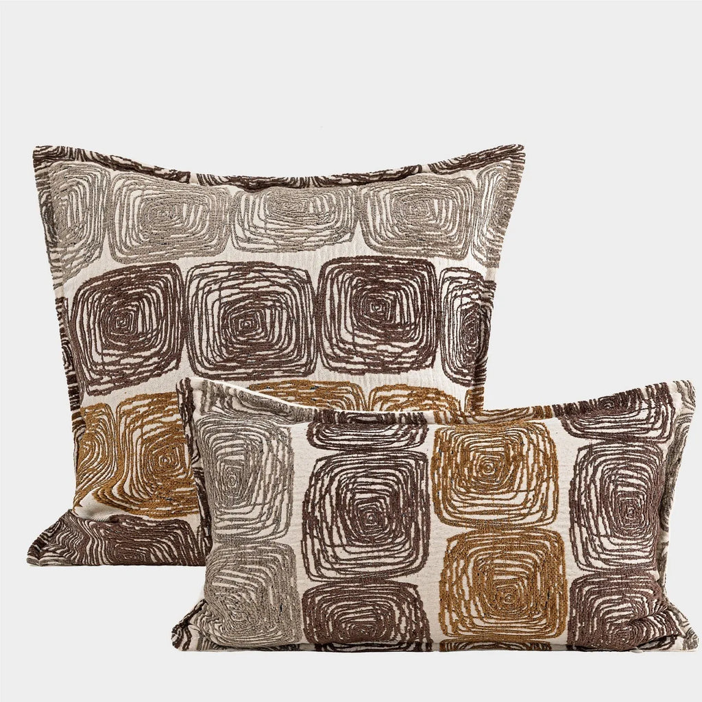 Cream and coffee-coloured abstract coil pattern pillow cover shown in square and rectangular sizes
