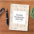 A5 Weekly Pregnancy Diary Notebook open showing weekly sections for pregnancy tracking