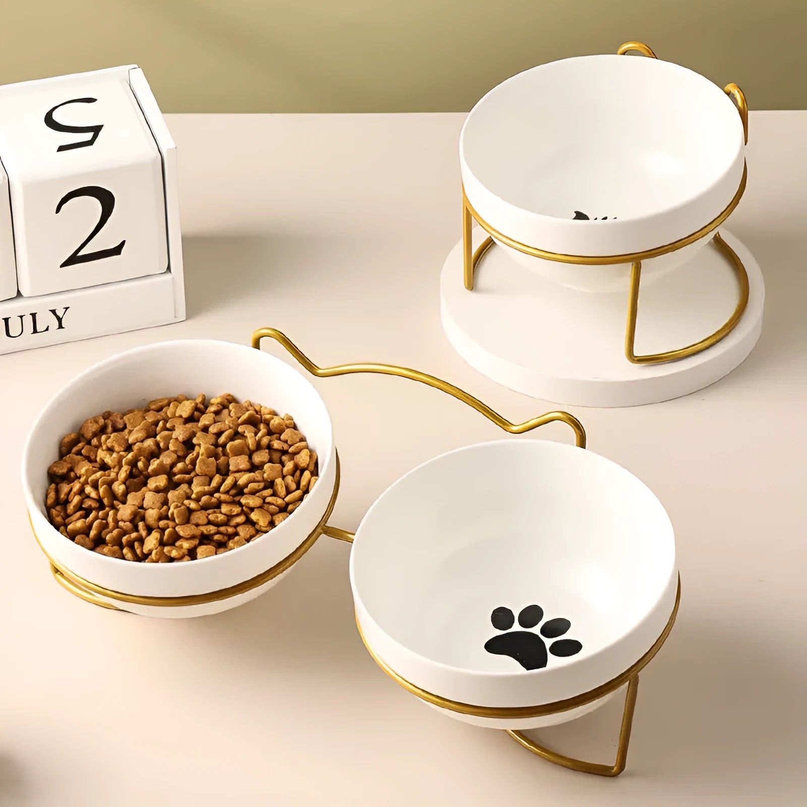 White ceramic cat bowl with decorative pattern on iron frame with cat ear accents