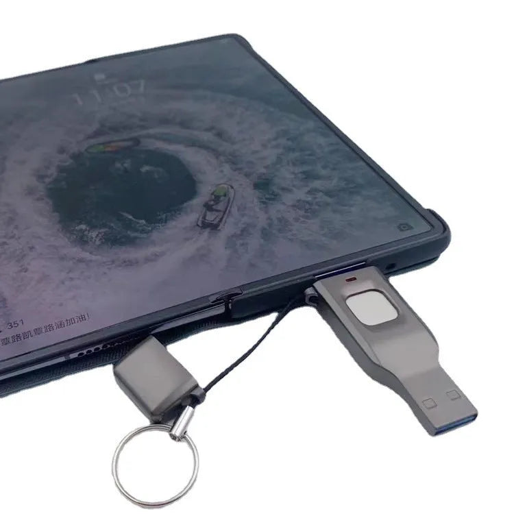 Black encrypted USB flash drive with fingerprint sensor showing USB 3.0 and USB-C connectors