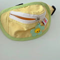 Backpack-style poop bag dispenser for dogs and cats in powder blue with adjustable messenger bag straps