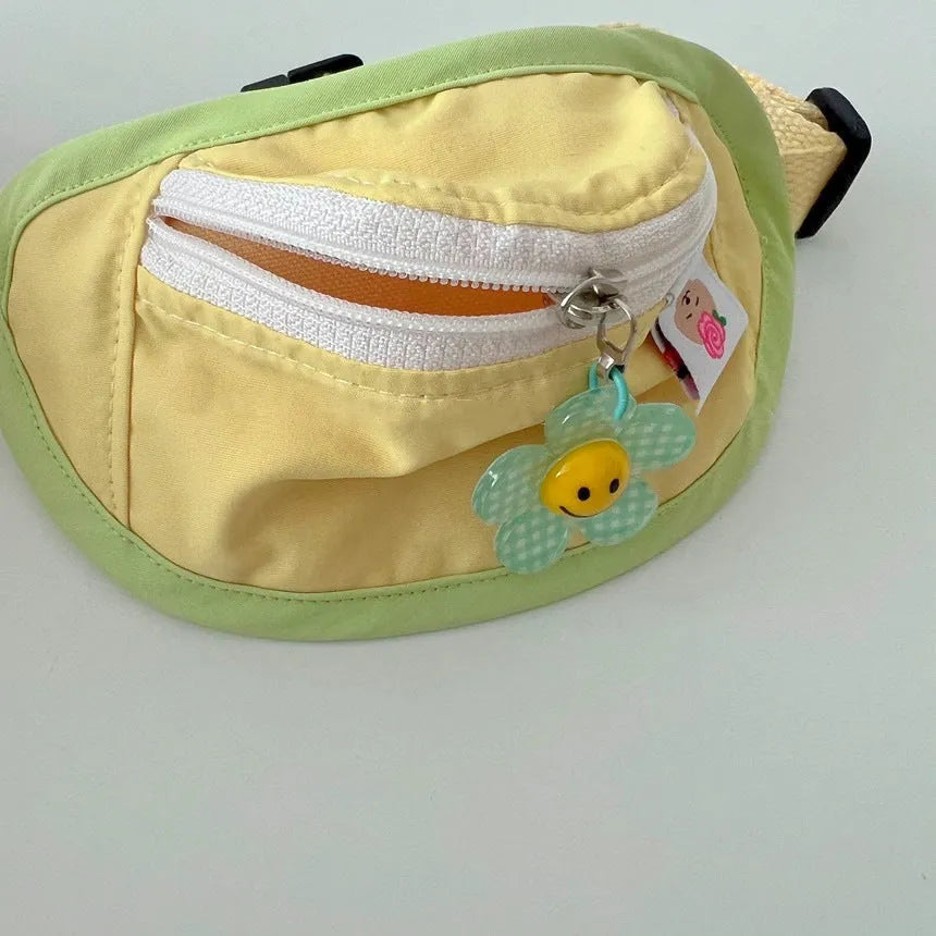 Backpack-style poop bag dispenser for dogs and cats in powder blue with adjustable messenger bag straps