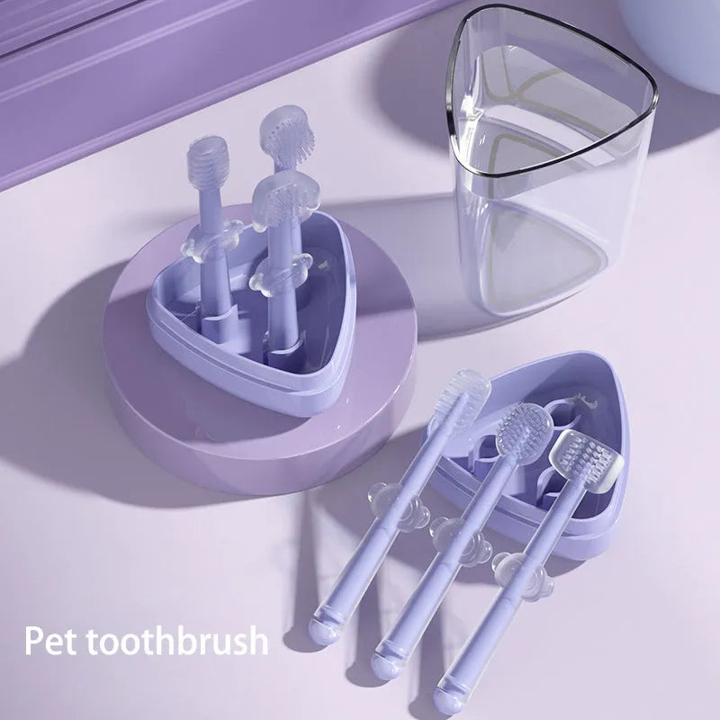 Blue, green, and purple silicone pet toothbrushes for dog and cat dental cleaning.