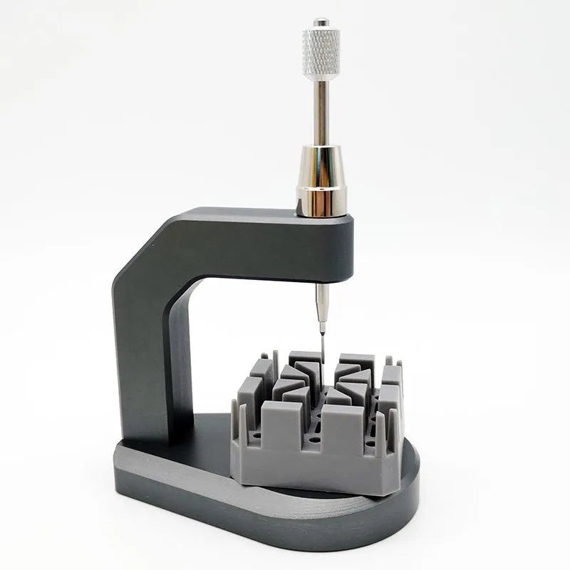 Silver multi-purpose press strap removal tool made of tool steel for watch and jewellery repair.