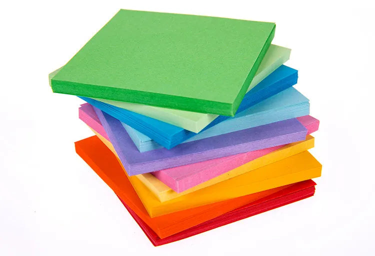 Colourful assortment of small rolled paper scrolls with central holes for drift bottle messages