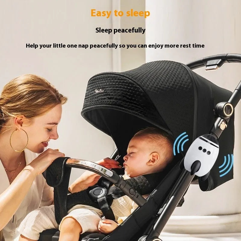 White portable baby sleep comforter with automatic shaking and Bluetooth connectivity, shown next to a stroller.