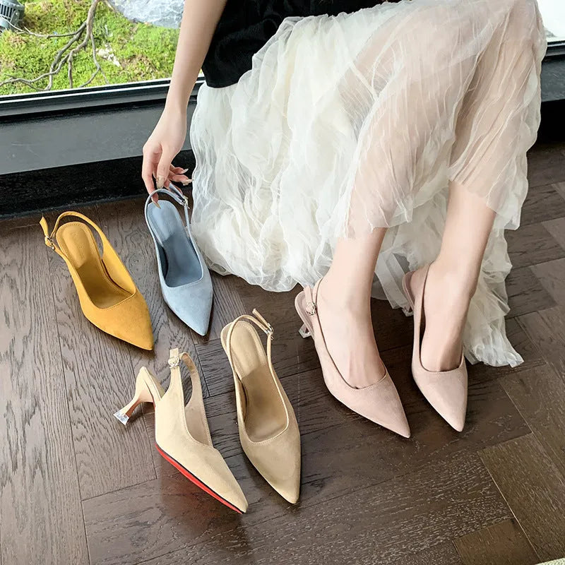 A pair of apricot-coloured suede pointed-toe stiletto high heels with a rubber sole.