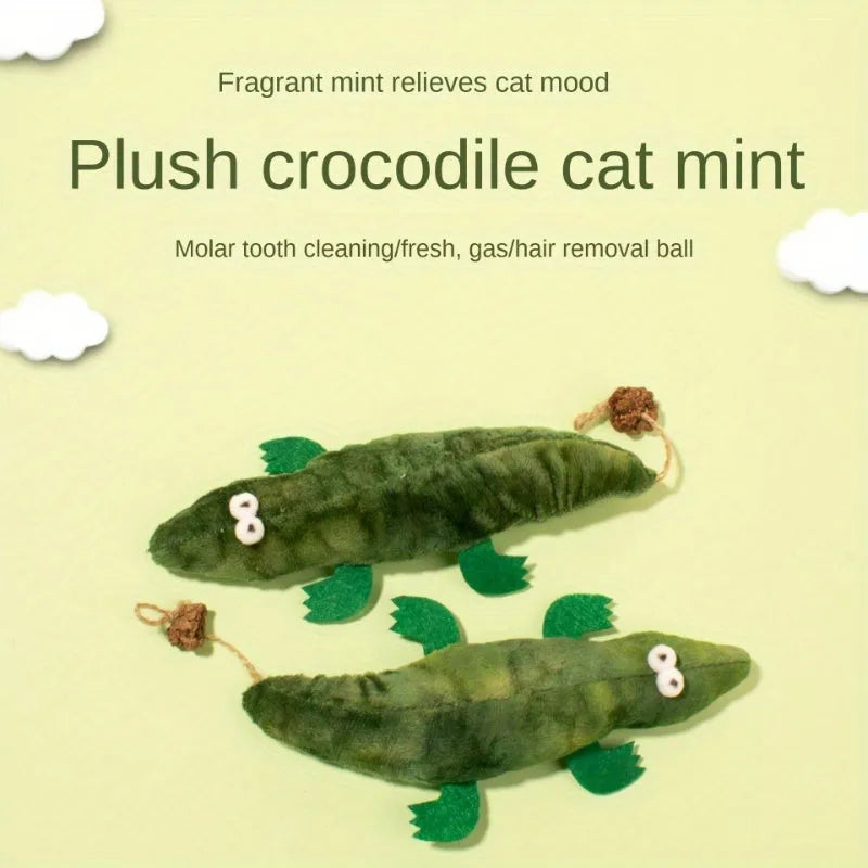 Green plush alligator catnip toy with plant-based materials and peppermint scent for feline oral cleansing