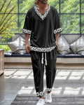 Lightweight polyester V-neck suit set with cropped sleeves and matching trousers on a hanger.