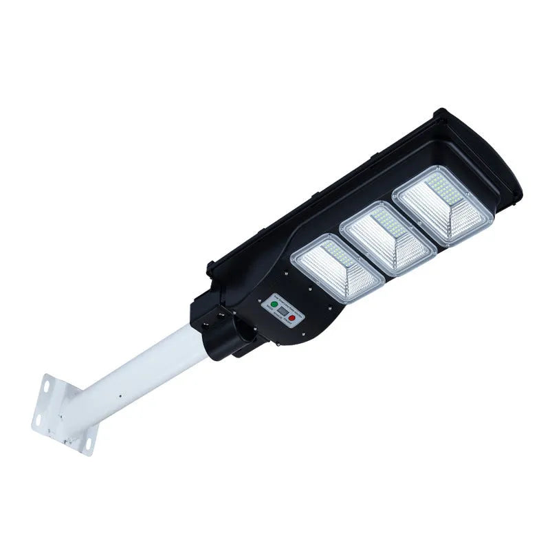 Integrated solar street light unit with solar panel and LED light in single housing for outdoor use