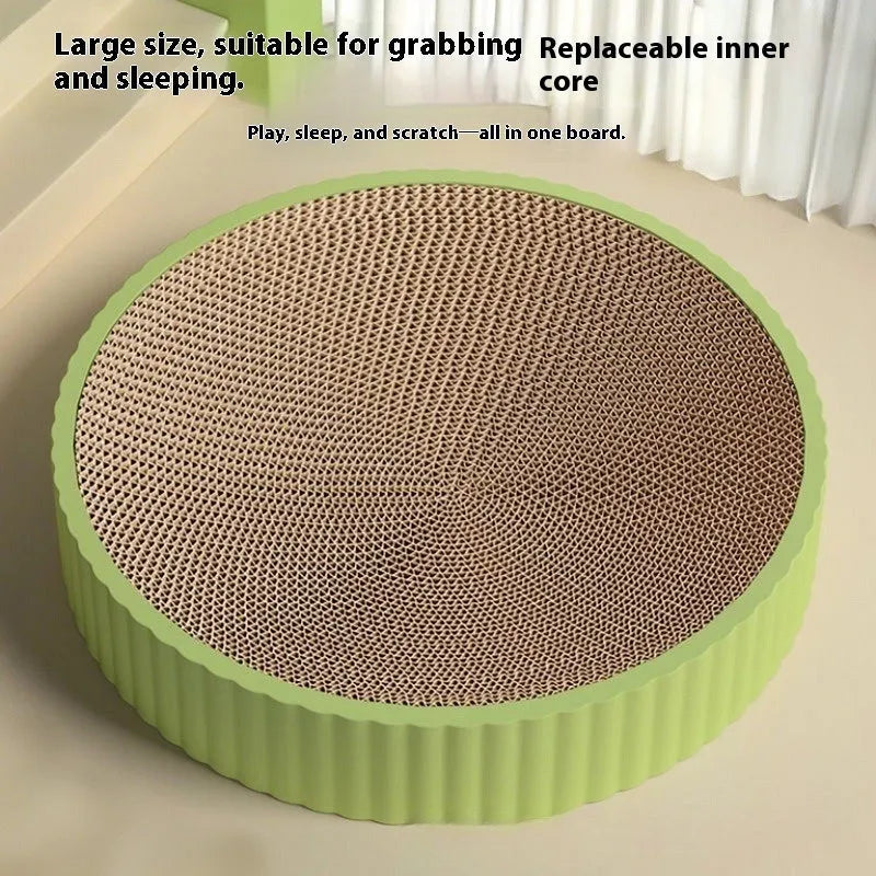 Green round cat scratching board with corrugated cardboard surface measuring 55cm diameter