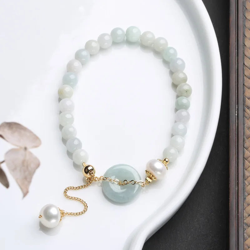 Natural emerald green jade and pearl bracelet with geometric peace buckle closure