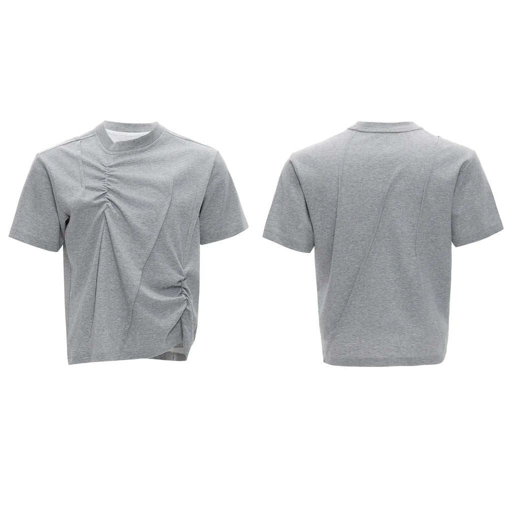 Men's loose grey cotton t-shirt with three-dimensional pleats and asymmetric stitching detail.