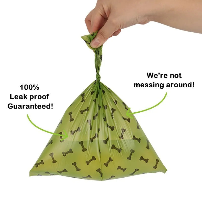 Roll of degradable military green dog poop bags with black bone print, showing bag size and dispenser option.