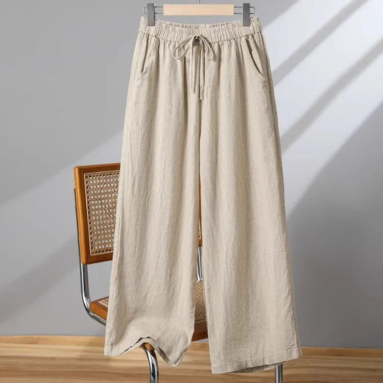 Women's apricot straight-leg casual trousers with elastic waist and lace-up detail.