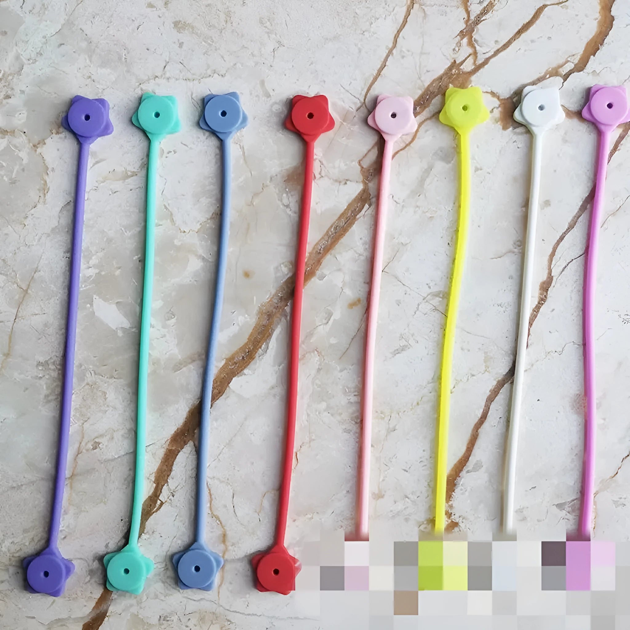 Silicone magnet wire winder for cable organisation in purple colour