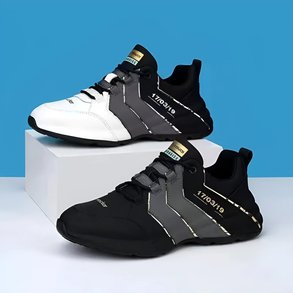 Casual low-top sneaker for teens in black and grey with thick plastic sole and lace-up front.
