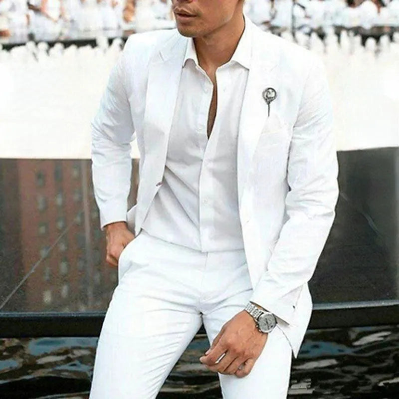 Men's white two-piece wedding suit with slim fit styling and cotton-acetate fabric blend