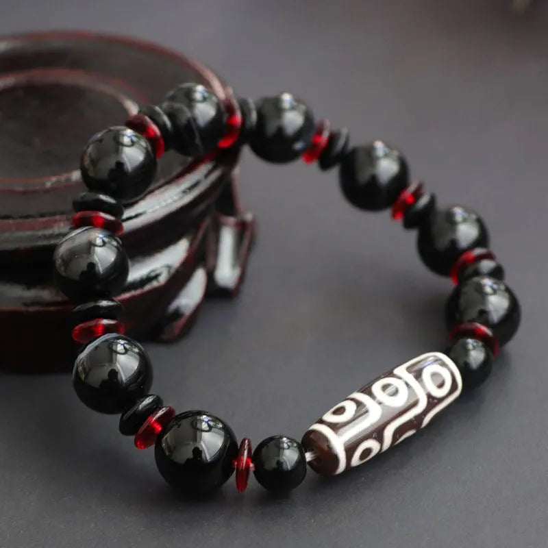 Black agate dzi bead bracelet with 11mm geometry beads and hand-woven construction