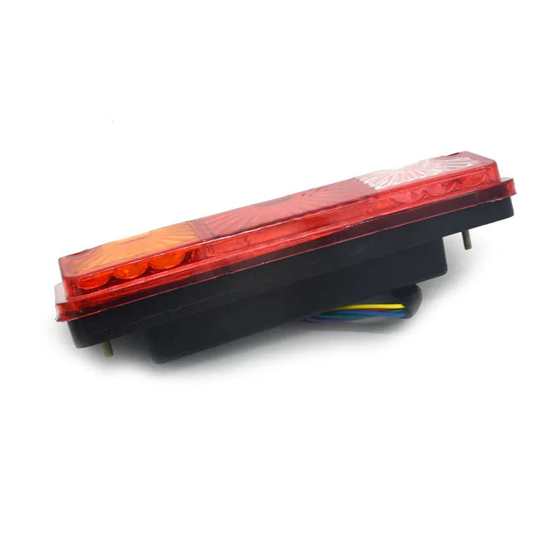 Black semi-closed taillight for an electric tricycle, showing its integrated shell design.