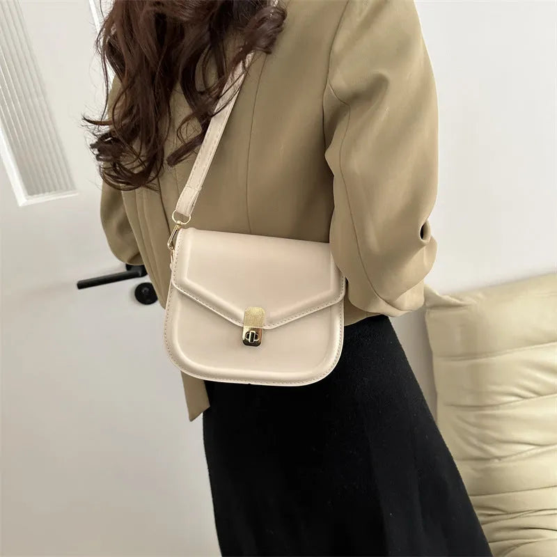 Soft niche texture PU messenger bag in horizontal square clamshell design shown in black colour.
