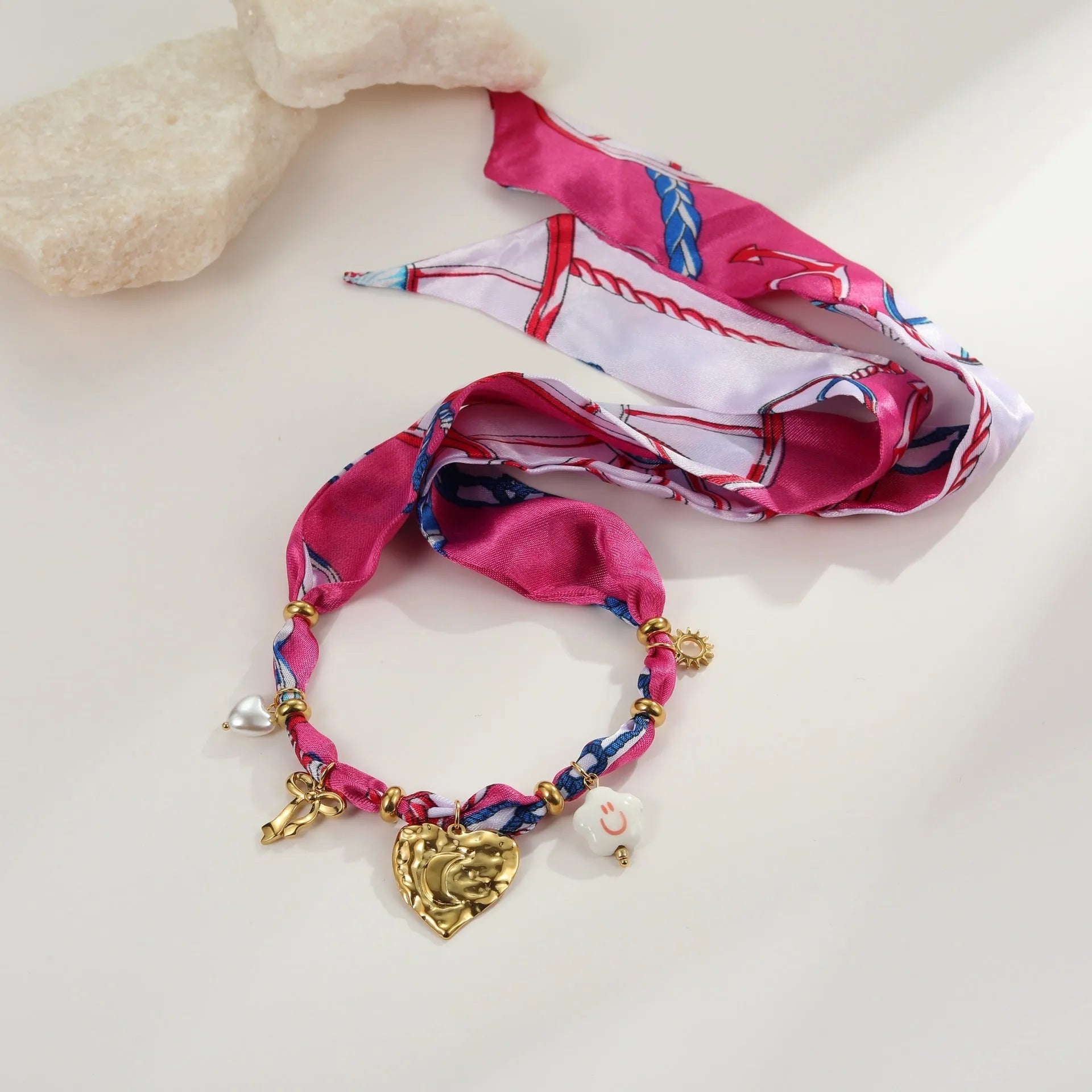 Stainless steel jewellery set with geometric pendant necklace and matching bracelet featuring 18K gold plating