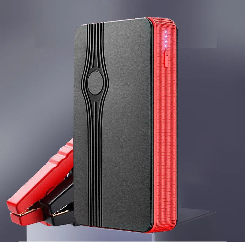 Red K4-E automotive emergency jump starter and power bank unit with USB cable