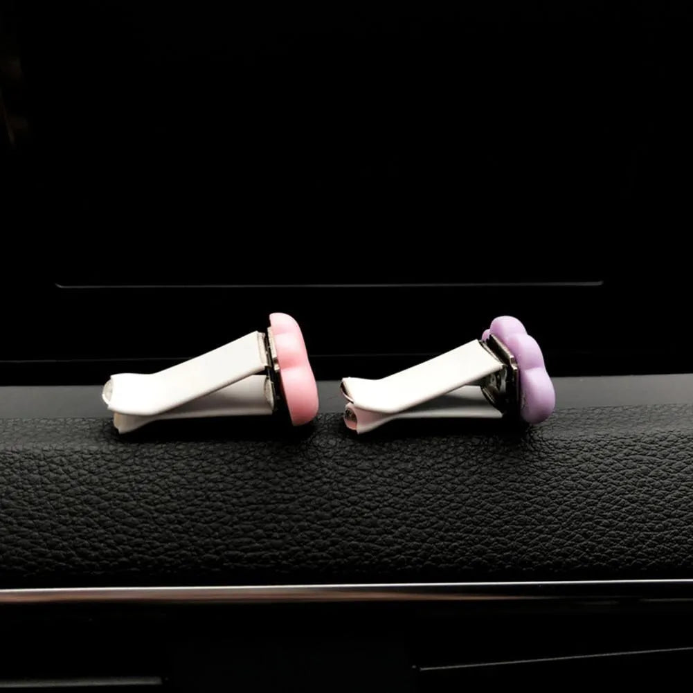 Resin Baiyun cartoon character car air vent fragrance clip in assorted colours.