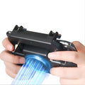 Black mobile game controller with USB connector for smartphones on a table.
