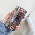 Silicone iPhone case with printed eye shadow colour palette design in flesh colour.