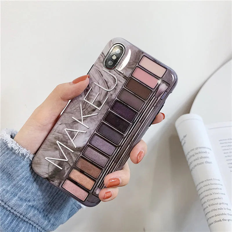 Silicone iPhone case with printed eye shadow colour palette design in flesh colour.