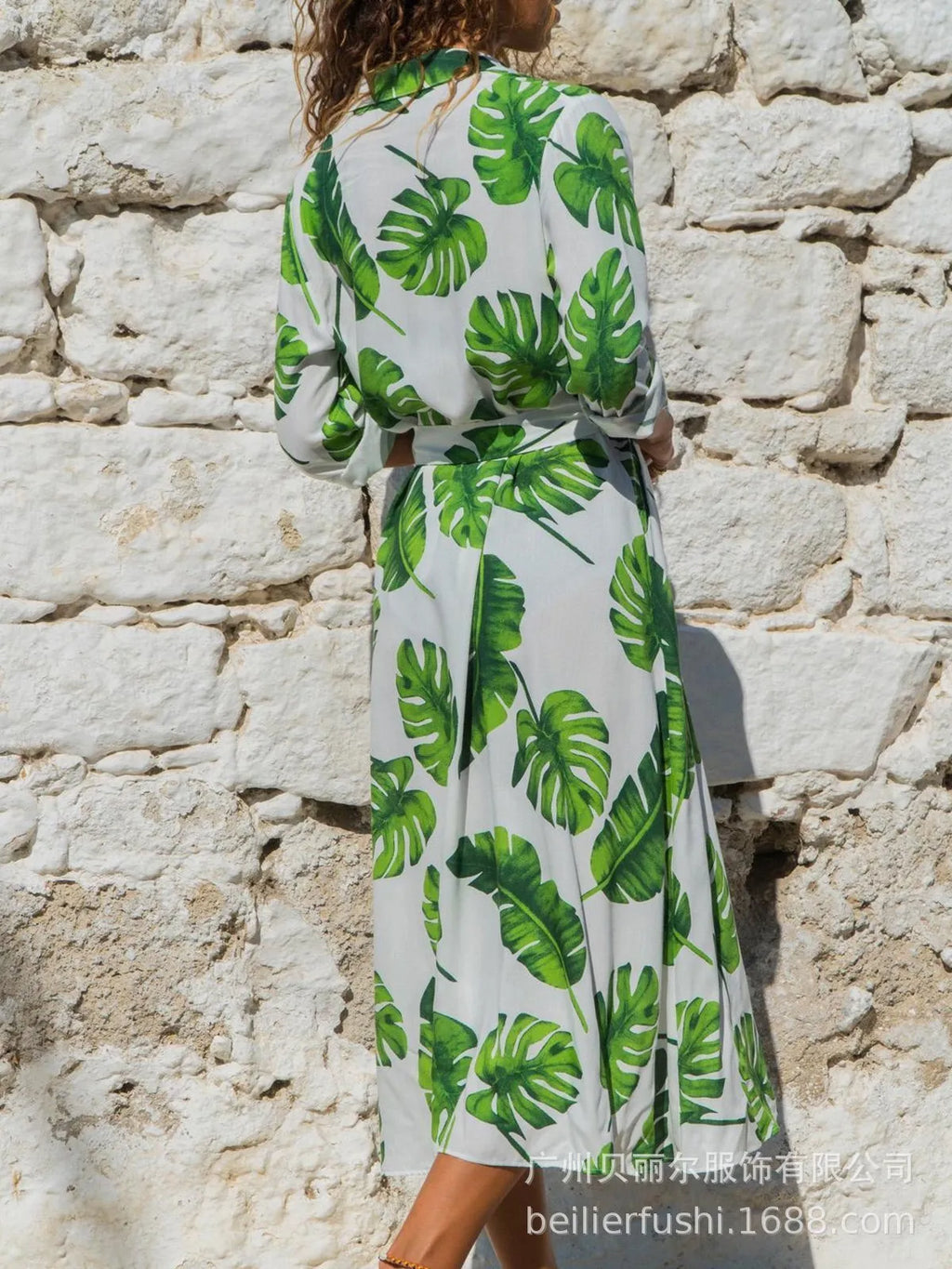 Women's white V-neck chiffon dress with printed A-line skirt and high waist on a hanger.