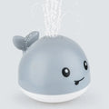 Automatic electric whale bath toy spraying water with flashing coloured lights