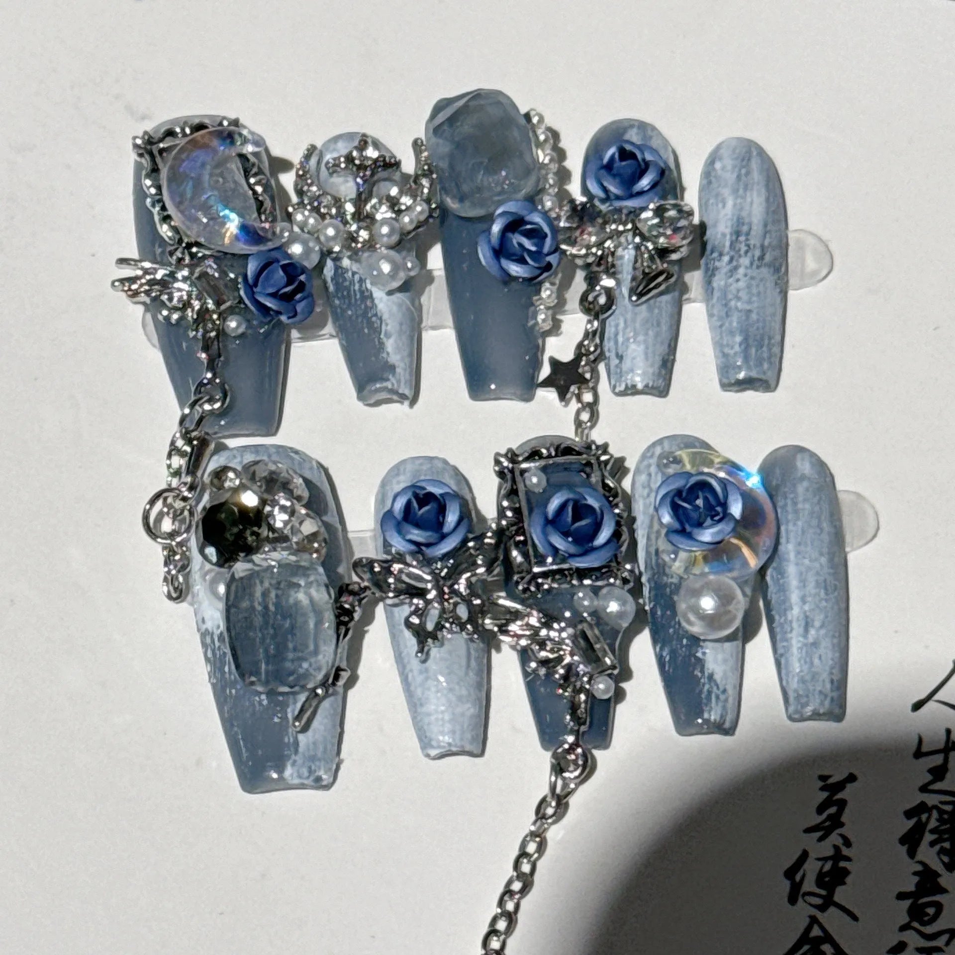 Heavy industry blue nail stickers with twinkling rose and tulip patterns for evening manicures