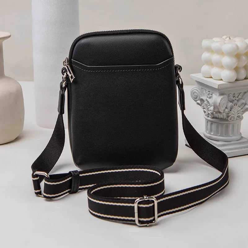 Small solid colour crossbody shoulder bag for women, shown in beige.