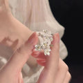 Three-dimensional jasmine flower adjustable ring in zinc alloy with open mouth design
