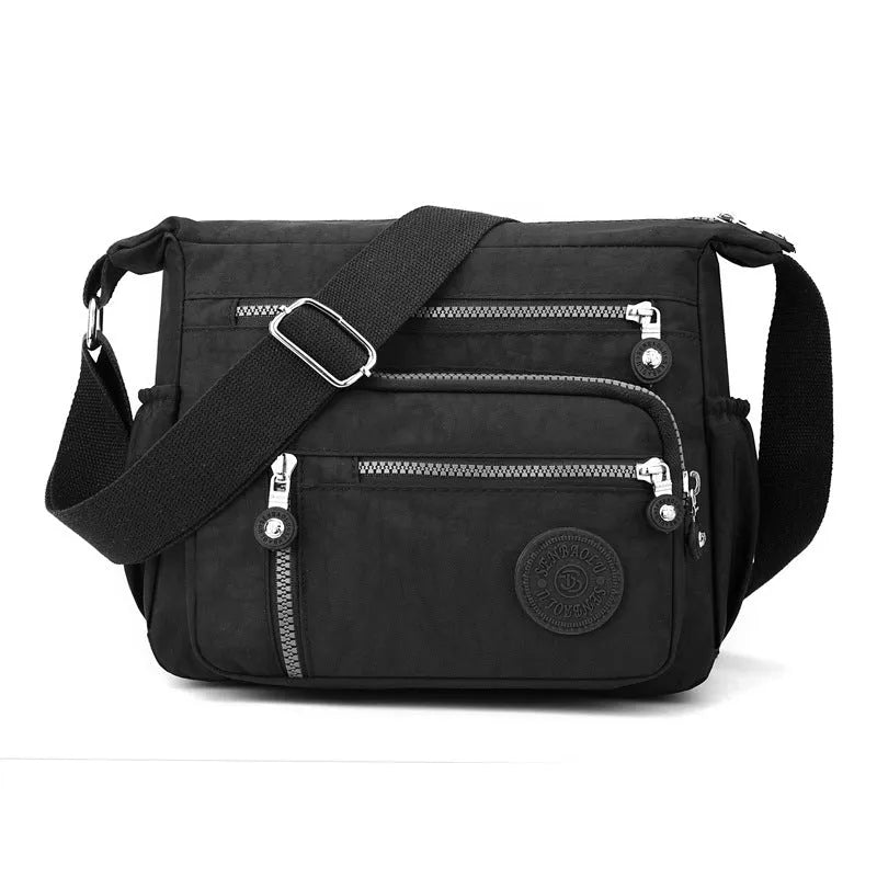 Gray nylon shoulder messenger bag with square vertical design and single strap