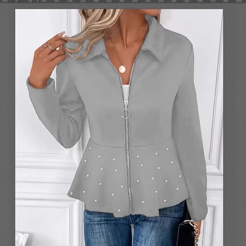 Women's black loose-fit coat with heavy-duty zipper front and ruffled hem detail.
