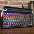 Black retro mechanical keyboard with 83 keys, metal body, and seven-colour backlight on a desk