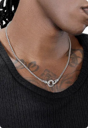 Simple sterling silver S925 necklace on a white background, showing a close-up of the chain links.