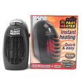 Black compact ceramic heater with digital display and rotating plug on desk
