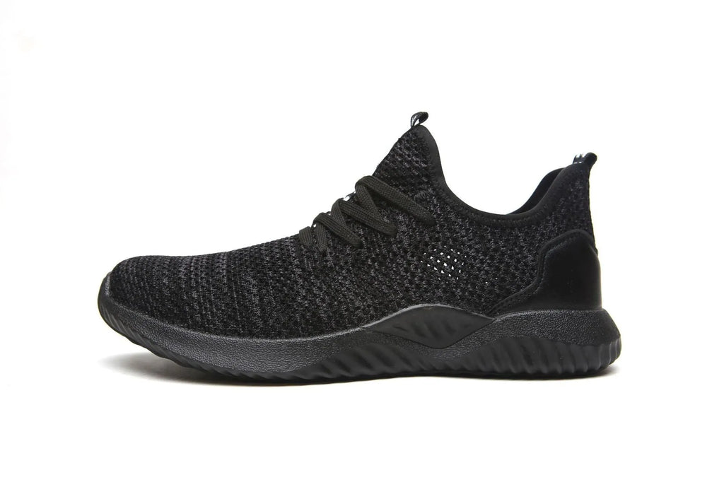 Low-cut black safety work shoes with a steel toe cap and EVA midsole on a grey background.