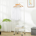 White iron single rod pulley storage car on an overhead track for wardrobe organisation.
