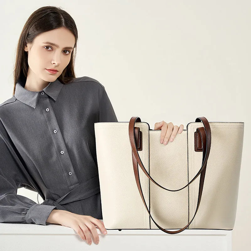 Women's black genuine leather crossbody shoulder bag with horizontal square shape and multiple internal compartments