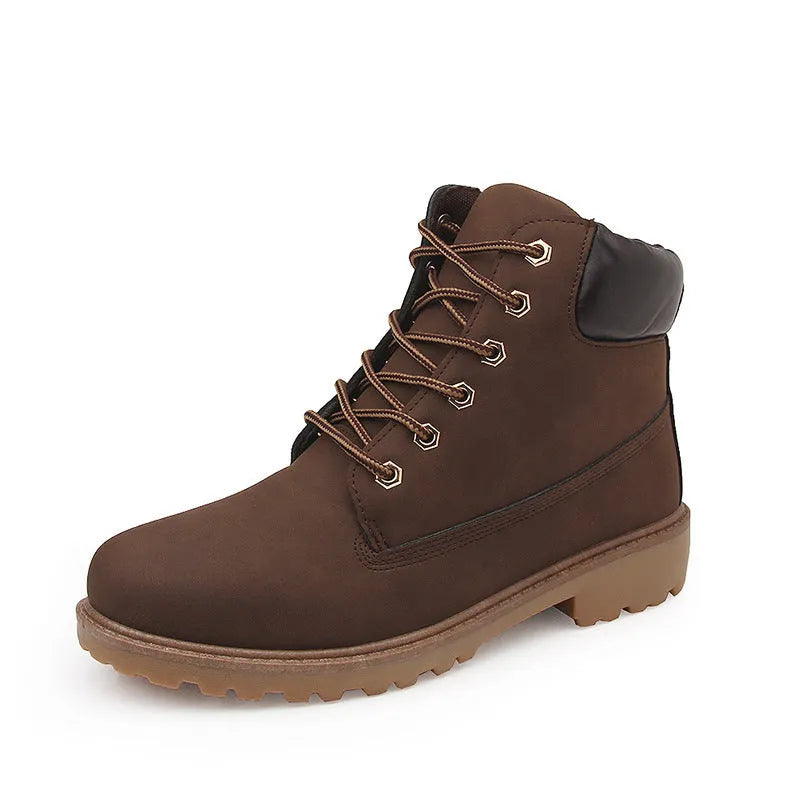 Men's pink Martin boots with velvet lining, flat sole, and round toe on a lace-up high-top.