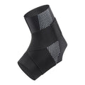 Black Lycra ankle support brace wrapped around an adult ankle.