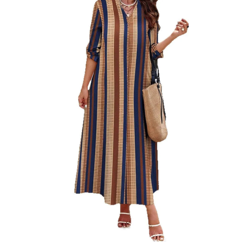 Camel coloured women's knit dress with vertical stripes, V-neck and long sleeves in A-line silhouette
